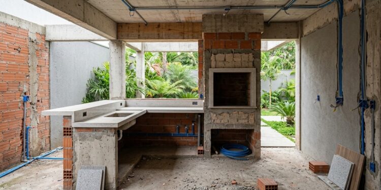 Quanto custa construir uma área gourmet completa com churrasqueira, pia e bancada em 2026?