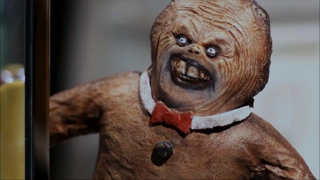 Foto mostra vilão do filme, um biscoto de gengibre de aspecto humanoide.