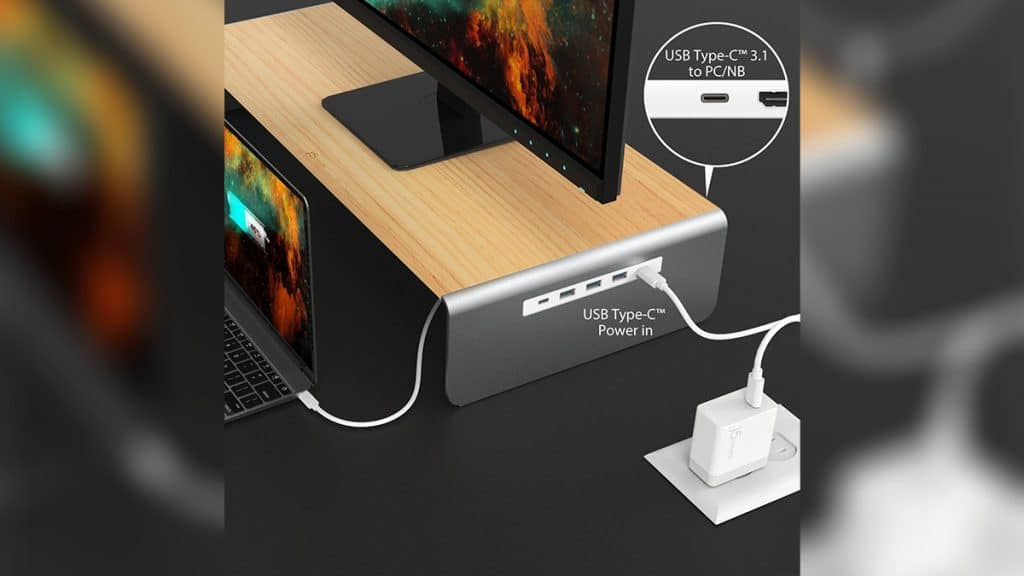 Dock station do tipo computer stand com monitor e notebook conectados a ele