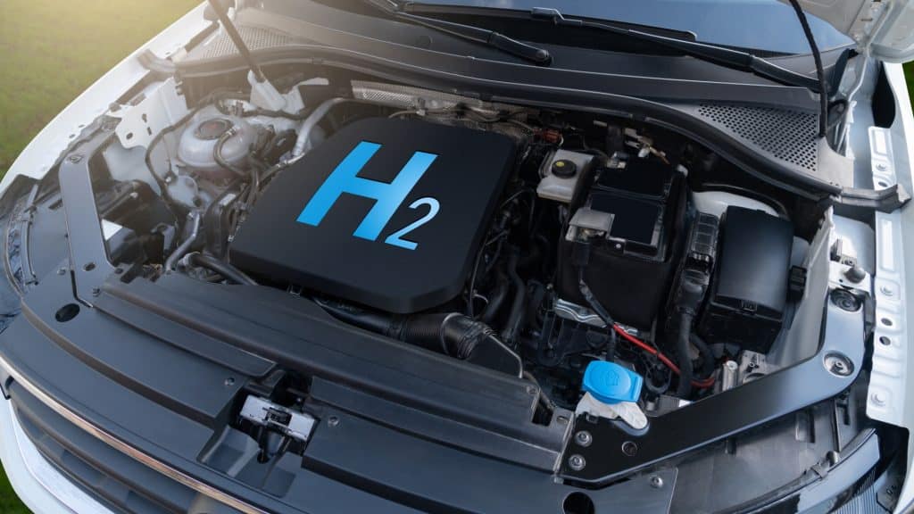 Motor de carro com o símbolo H2, forma molecular formada através da ligação covalente entre dois átomos de hidrogênio