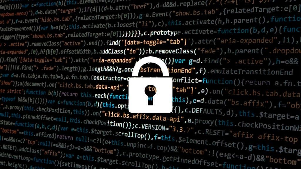 Ícone de cadeado em frente tela de computador com códigos