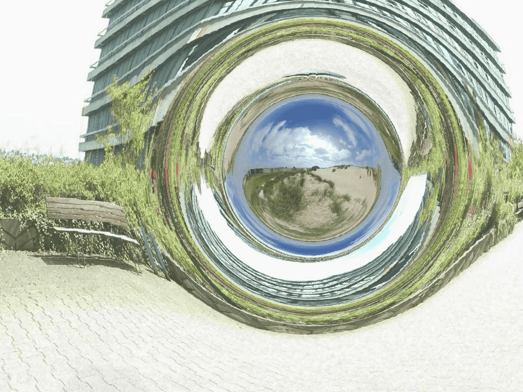 [ Simulação de um buraco de minhoca ligando a frente do Instituto de Física da Universidade de Tübingen, na Alemanha, às dunas de areia próximas a Boulogne-sur-Mer, na França - Imagem: CorvinZahn - Gallery of Space Time Travel / wikimedia.org ]