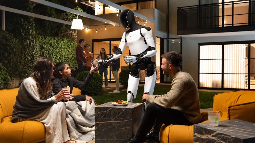 Robô Optimus, da Tesla, servindo bebidas para pessoas sentadas