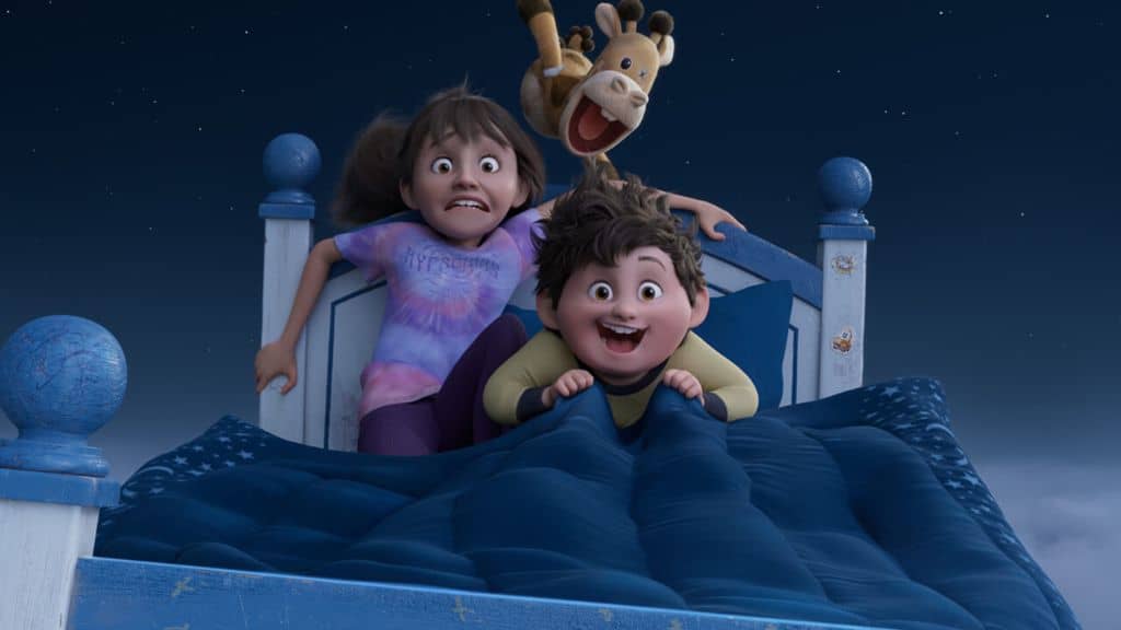 As 5 melhores animações de 2025 2025 está sendo um prato cheio para quem curte animação. Depois de alguns anos dominados por continuações previsíveis e produções que tentavam surfar no hype das franquias, o ano finalmente trouxe algo mais ousado. Histórias melhor construídas, visuais mais ambiciosos, tramas que não subestimam o público. Por isso, separamos 5 das melhores animações que surgiram em 2025! Crianças animadas sobre uma cama azul, aparentemente voando, com um brinquedo de girafa no ar atrás delas