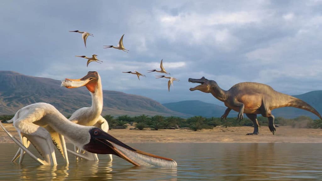 Dois pterossauros em lagoa enquanto dinossauro maior e outros dinossauros voadores aparecem ao fundo